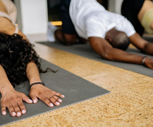 Group of diverse people in a relaxed yoga class.